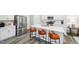 Modern kitchen with white cabinets, stainless steel appliances, an island and bar seating at 1412 Maple Branch Cir # 35, Graham, NC 27253