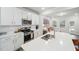 Stylish kitchen with white cabinets, stainless steel appliances, and seamless connection to the living area at 1412 Maple Branch Cir # 35, Graham, NC 27253