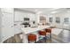 Well-designed kitchen with white cabinets, stainless steel appliances, and barstool seating at the island at 1412 Maple Branch Cir # 35, Graham, NC 27253