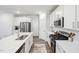 Modern kitchen featuring stainless steel appliances, white cabinetry, and efficient layout for cooking at 1412 Maple Branch Cir # 35, Graham, NC 27253