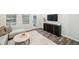 Comfortable living area with stylish furniture, a flat-screen TV and wood flooring at 1412 Maple Branch Cir # 35, Graham, NC 27253