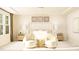 Elegant main bedroom featuring decorative wall art, sitting area, and abundant natural light at 1412 Maple Branch Cir # 35, Graham, NC 27253