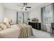 Cozy bedroom with neutral tones, featuring a ceiling fan and natural light at 145 Cassada Ct, Holly Springs, NC 27540