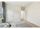 Bedroom featuring neutral carpet, and views out of a bright window at 145 Cassada Ct, Holly Springs, NC 27540