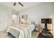 Bedroom with a ceiling fan, media center and plenty of light at 145 Cassada Ct, Holly Springs, NC 27540