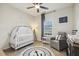 Sweet Bedroom featuring a crib, nautical decor, and ample natural light at 145 Cassada Ct, Holly Springs, NC 27540