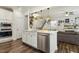 Kitchen island featuring stainless steel appliances, white countertops and access to living space at 145 Cassada Ct, Holly Springs, NC 27540