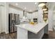 Well-equipped kitchen with stainless steel refrigerator and white cabinetry at 145 Cassada Ct, Holly Springs, NC 27540