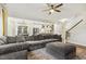 Spacious living room with an open floor plan and views of the kitchen and staircase at 145 Cassada Ct, Holly Springs, NC 27540