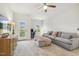 Inviting living room with a comfortable seating area, TV, and backyard view at 145 Cassada Ct, Holly Springs, NC 27540