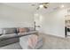 Relaxing living room area, featuring a large sofa and plenty of open space at 145 Cassada Ct, Holly Springs, NC 27540