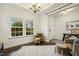 Bright living space with dark floors, white walls, and an abundance of natural light at 145 Cassada Ct, Holly Springs, NC 27540