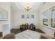 Inviting living area with dark wood floors and lots of natural light from three windows at 145 Cassada Ct, Holly Springs, NC 27540
