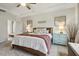 Main bedroom showcasing coordinated decor and an open doorway, creating a cohesive, airy feel at 145 Cassada Ct, Holly Springs, NC 27540