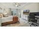 Spacious main bedroom with a large bed, TV, and an office setup for convenience and relaxation at 145 Cassada Ct, Holly Springs, NC 27540