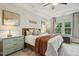 Bright main bedroom with a comfortable bed, bedside tables, and a serene, inviting atmosphere at 145 Cassada Ct, Holly Springs, NC 27540
