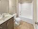 Modern bathroom featuring a shower-tub combo, toilet, and sleek vanity sink at 1517 Chestnut Falls Rd, Wendell, NC 27591
