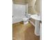 Bathroom featuring a pedestal sink, toilet, and a shower-tub combination at 1517 Chestnut Falls Rd, Wendell, NC 27591