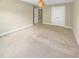 Neutral bedroom with light-colored walls, carpet, and large double door closet at 1517 Chestnut Falls Rd, Wendell, NC 27591