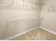 Walk in closet features wire racks for optimum storage of clothes and other personal items at 1517 Chestnut Falls Rd, Wendell, NC 27591