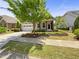 Charming single-story home featuring a landscaped front yard and a two-car garage at 1517 Chestnut Falls Rd, Wendell, NC 27591