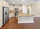 Kitchen features granite countertops, stainless steel appliances, and hardwood floors at 1517 Chestnut Falls Rd, Wendell, NC 27591