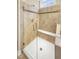 Modern walk-in shower with glass doors, bench, and decorative tile accents at 1517 Chestnut Falls Rd, Wendell, NC 27591