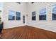 Spacious back deck area featuring wood flooring, white siding, and views to the backyard at 1704 Fawn Chase Ct, Wake Forest, NC 27587