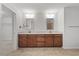 Bathroom boasts double sink vanity, framed mirrors, and tiled flooring at 1704 Fawn Chase Ct, Wake Forest, NC 27587