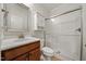 Bathroom featuring a glass enclosed shower, updated vanity, and tile floors at 1704 Fawn Chase Ct, Wake Forest, NC 27587