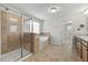 Bathroom features glass enclosed shower, soaking tub, and tiled floors at 1704 Fawn Chase Ct, Wake Forest, NC 27587