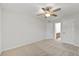 This bedroom features neutral carpet, white walls, and a ceiling fan at 1704 Fawn Chase Ct, Wake Forest, NC 27587