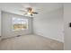 Carpeted bedroom featuring a window, neutral paint, and a ceiling fan at 1704 Fawn Chase Ct, Wake Forest, NC 27587