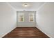 Bright bedroom with two windows and hardwood floors at 1704 Fawn Chase Ct, Wake Forest, NC 27587