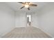 The bedroom features neutral carpet, white walls, and a ceiling fan at 1704 Fawn Chase Ct, Wake Forest, NC 27587