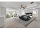 Staged primary bedroom features plush carpet, large rug, and designer furnishings at 1704 Fawn Chase Ct, Wake Forest, NC 27587