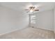 Carpeted bedroom with window, fan, and neutral paint at 1704 Fawn Chase Ct, Wake Forest, NC 27587