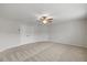 This bedroom includes carpet flooring, a ceiling fan, and a closet at 1704 Fawn Chase Ct, Wake Forest, NC 27587