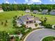 Aerial view of a community pavilion featuring outdoor seating, landscaping, and a nearby parking lot at 1704 Fawn Chase Ct, Wake Forest, NC 27587
