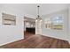 Open dining area with a chandelier and views into the living room at 1704 Fawn Chase Ct, Wake Forest, NC 27587