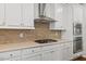 Well-equipped kitchen with stainless steel appliances, gas cooktop, and ample counter space at 1704 Fawn Chase Ct, Wake Forest, NC 27587
