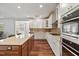 Gourmet kitchen boasts a large island, double ovens, and sleek countertops at 1704 Fawn Chase Ct, Wake Forest, NC 27587