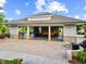 Open-air pool house with stone accents, offering shaded seating and a relaxing gathering space at 1704 Fawn Chase Ct, Wake Forest, NC 27587