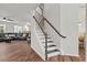 Staircase with white railings and wood steps, leading to the upper level at 1704 Fawn Chase Ct, Wake Forest, NC 27587