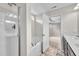 Bright bathroom featuring a walk-in shower, tub, double vanity, and tile flooring at 173 Forsyth Pkwy Pkwy, Clayton, NC 27520