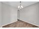Bright room with wood floors and modern chandelier at 173 Forsyth Pkwy Pkwy, Clayton, NC 27520