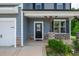 Charming front porch with stone accents and covered entry at 173 Forsyth Pkwy Pkwy, Clayton, NC 27520
