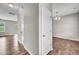 Hallway with wood floors leading to bright rooms at 173 Forsyth Pkwy Pkwy, Clayton, NC 27520