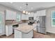Well-equipped kitchen showcasing stainless steel appliances, granite counters, and ample cabinetry at 173 Forsyth Pkwy Pkwy, Clayton, NC 27520