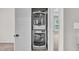 Laundry room with stacked washer and dryer, with extra storage space at 173 Forsyth Pkwy Pkwy, Clayton, NC 27520